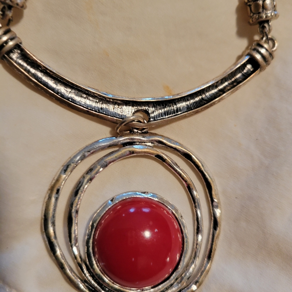 Silver necklace with red stone pendant